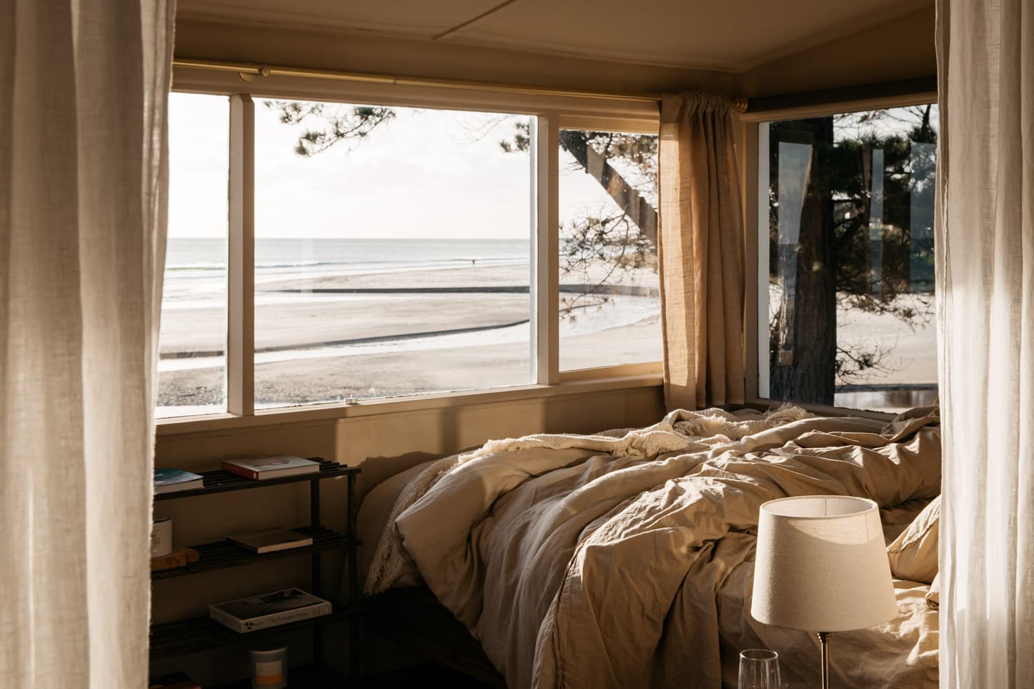 Master bedroom with a view of the beach and ocean