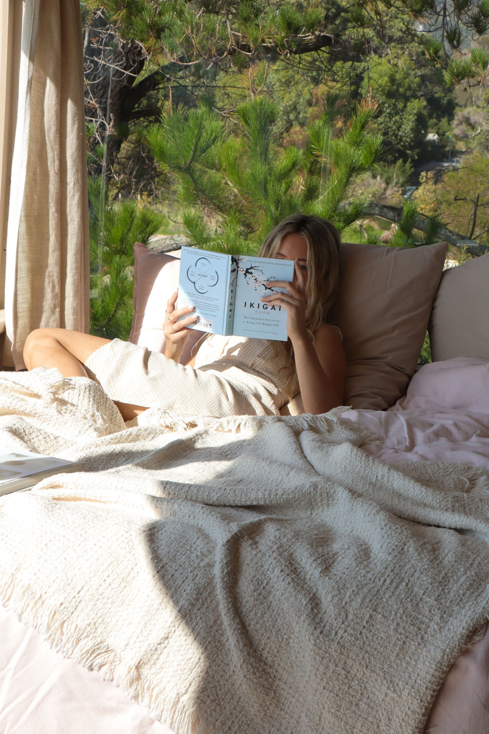 Woman reading on bed